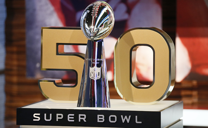 A detail view of the Vince Lombardi Trophy and the 50 numerical symbol indicating the celebration of upcoming Super Bowl 50 is seen during a media availability at the NFL Network studios, Wednesday, Sept. 9, 2015, in Culver City, California. (AP Photo/Danny Moloshok)